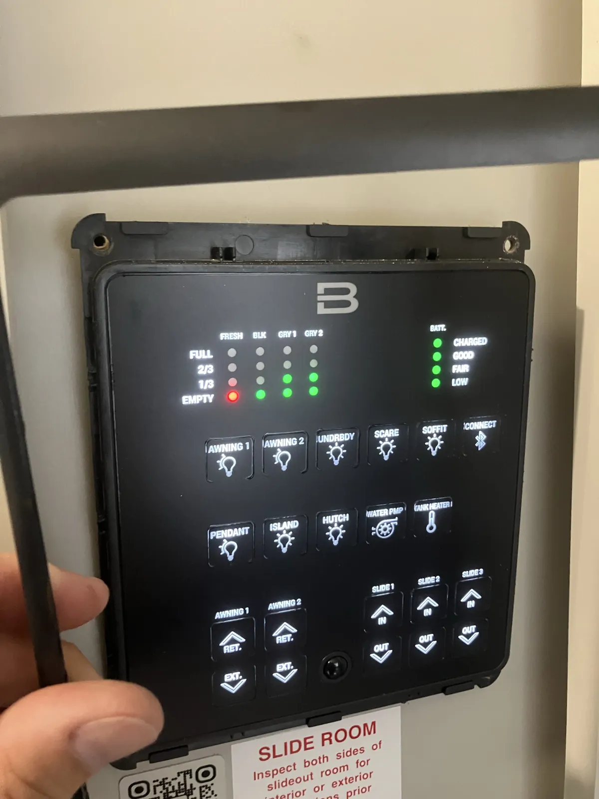 Brinkley Smart-Command monitor panel pulled forward from the wall with Slide 1, Slide 2 and Slide 3 controls visible