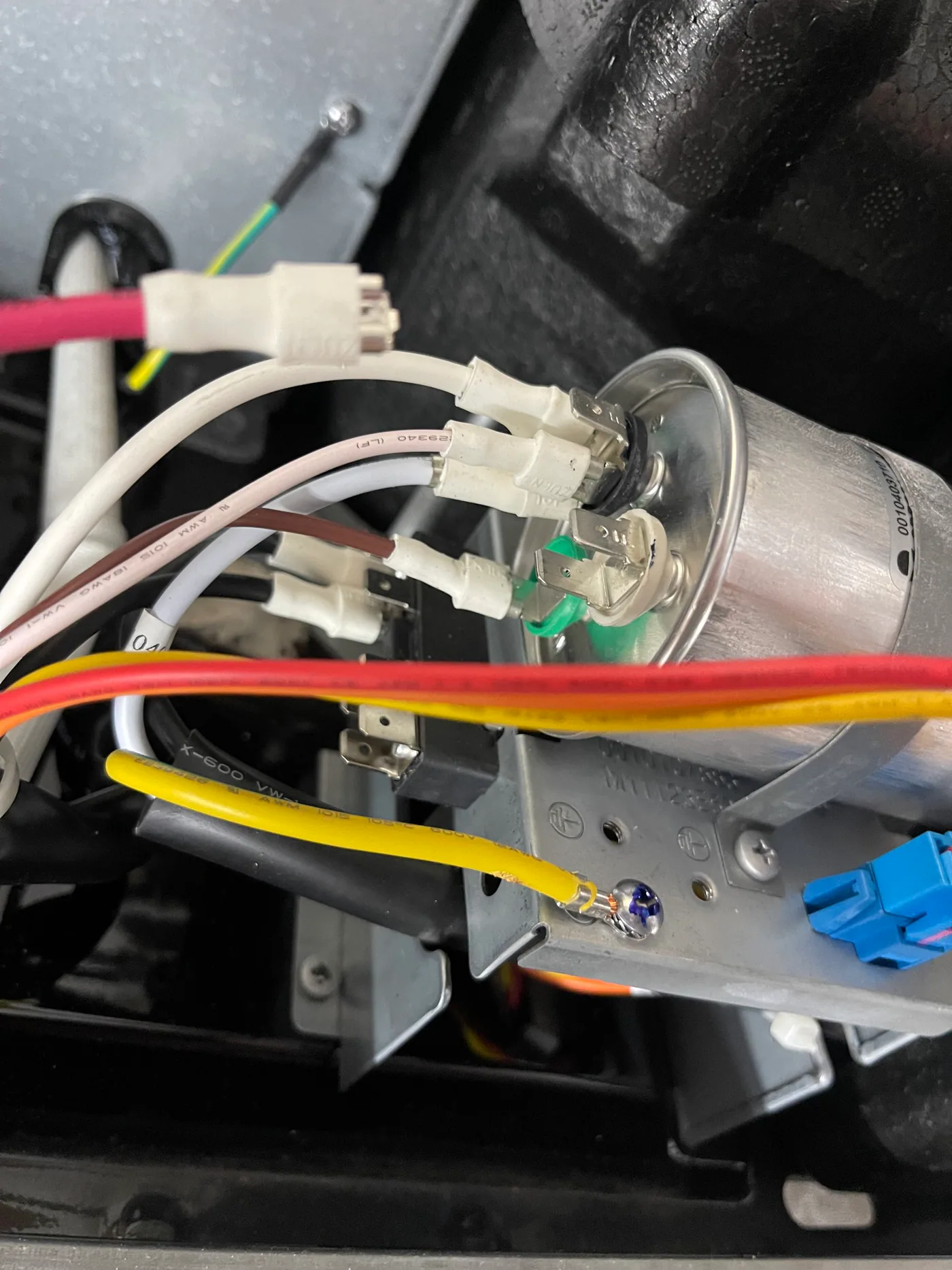 Run capacitor and terminal wiring inside a rooftop RV air conditioner