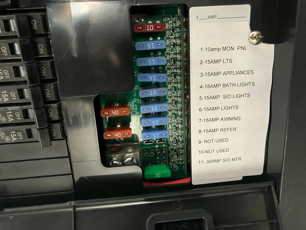 WFCO RV fuse panel label identifying a 15 amp awning fuse in position seven